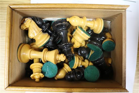 A weighted club-size chess set, two other boxed chess sets and a chess clock